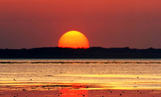 Sul Informação - Porque vemos o Sol achatado junto ao horizonte?