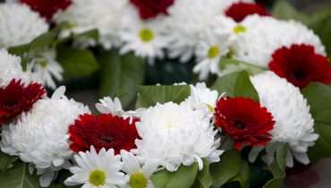 close up shot of red and white flower wreath