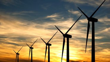 Wind turbines in a sunset