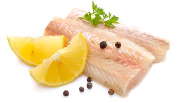 Raw Hake fish fillet pieces.