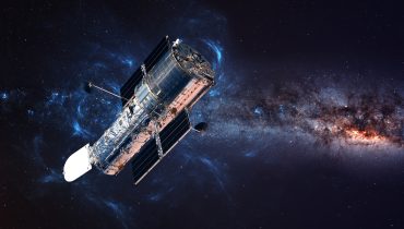 The Hubble Space Telescope in orbit above the Earth. Elements of this image furnished by NASA.|Space satellite over the planet earth
