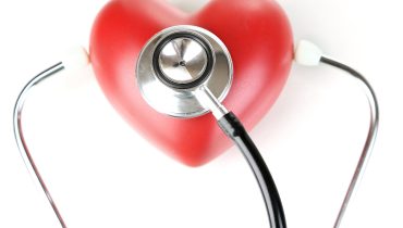 Stethoscope and heart isolated on white