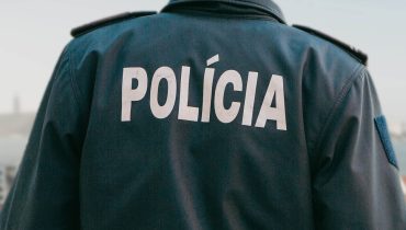 View from the back of a Portuguese policeman guards public order