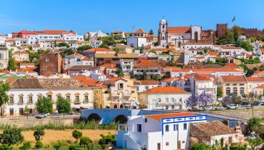 View of Silves town buildings with famous castle and cathedral, Algarve region, Portugal